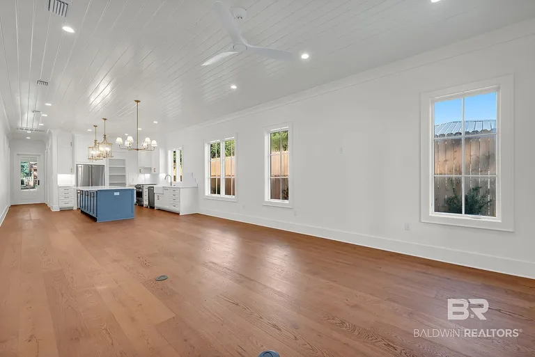 Open living and dining area leading to the kitchen at 410 Azalea St #101