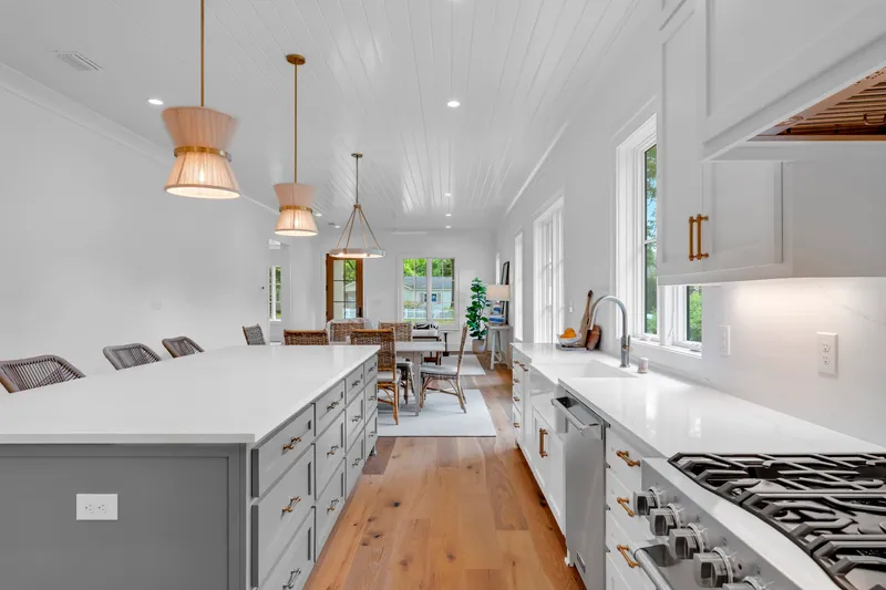 View from the kitchen range along the island toward the living area